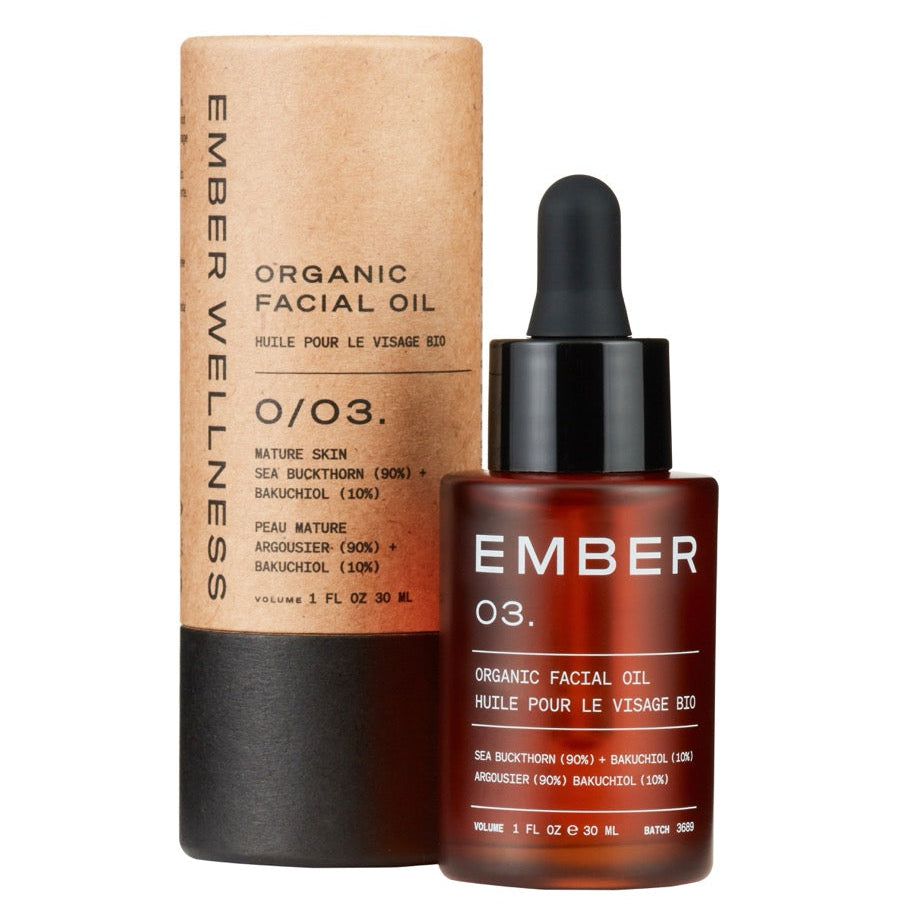 Ember Organic Wellness facial oil bottle with dropper and packaging on a white background