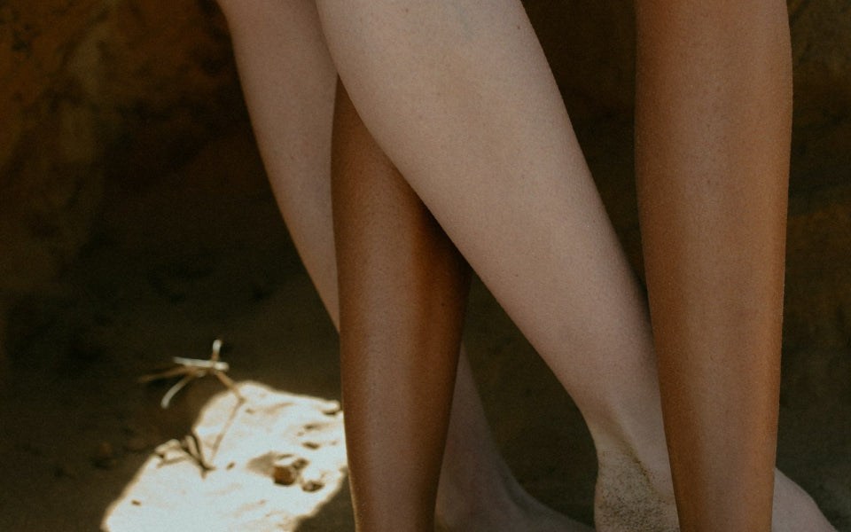 Peoples legs intertwined